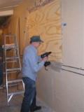 Larry Schrenk put some muscle into sealing the window.